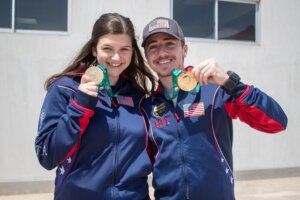 Katelyn Abeln and Henry Leverett with their gold medals from 25m Standard Pistol Mixed Team.